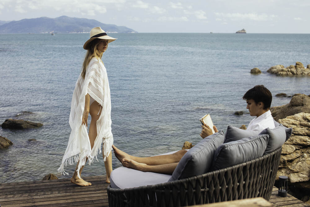 A couple in Cape Fahn Hotel’s Ocean View Pool Villa
